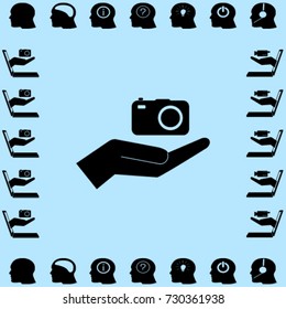 Camera in the hand icon, photo vector illustration