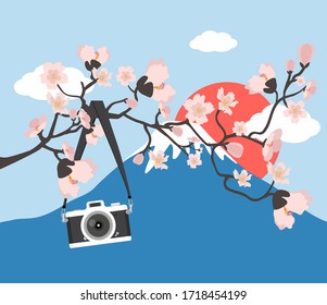 camera hanging pink floral branch with Mount Fuji