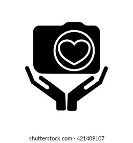 Camera  icon. Digital photo camera in hands - symbol.  Vector Image.
