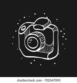Camera icon in doodle sketch lines. Digital photography professional photographer SLR