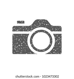 Camera icon in grunge texture. Vintage style vector illustration.