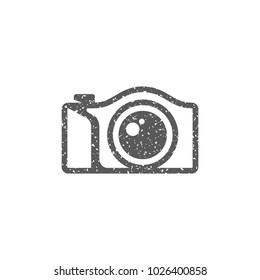 Camera icon in grunge texture. Vintage style vector illustration.