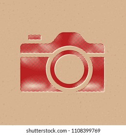 Camera icon in halftone style. Grunge background vector illustration.