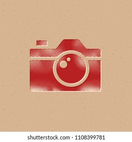 Camera icon in halftone style. Grunge background vector illustration.