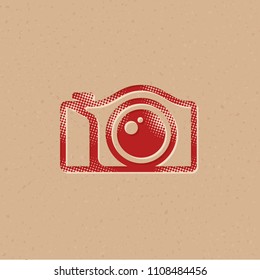 Camera icon in halftone style. Grunge background vector illustration.