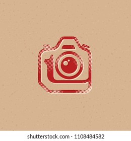 Camera icon in halftone style. Grunge background vector illustration.
