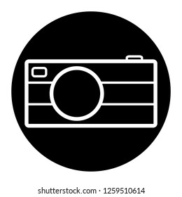 Camera icon on black circle. White background