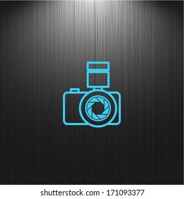 Camera icon on a dark background for your design, web icon