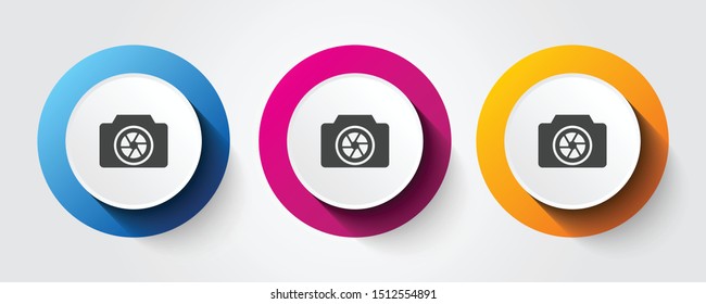 Camera icon on three colorful buttons.
