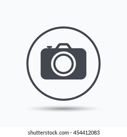 Camera icon. Professional photocamera symbol. Circle button with flat web icon on white background. Vector