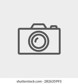 Camera icon thin line for web and mobile, modern minimalistic flat design. Vector dark grey icon on light grey background.