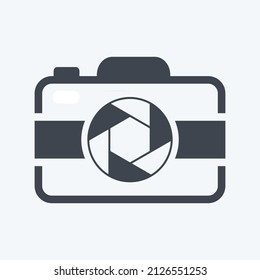 Camera Icon in trendy glyph style isolated on soft blue background