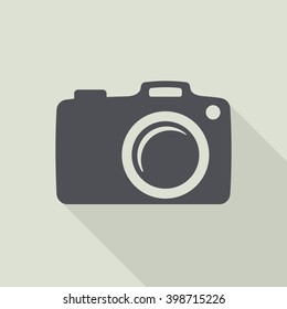 Camera Icon. Vector flat illustration white in black circle background.