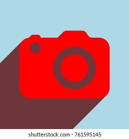 Camera icon. Vector. Red flat icon with infinte wine shadow to left down corner at sky background.