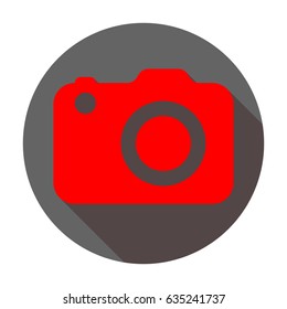 Camera icon. Vector. Red icon with reddish shadow on dark gray circle at white background. Isolated.