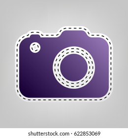 Camera icon. Vector. Violet icon with outline for cutting out at gray background.