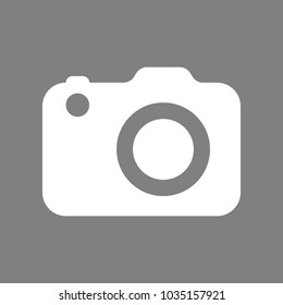 Camera icon. Vector. White icon on medium gray background. Isolated.