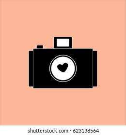 Camera icon for wedding concept isolated on orange background.