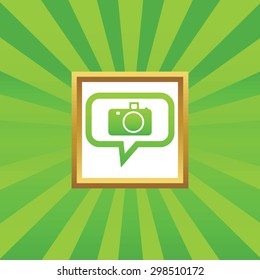Camera image in chat bubble, in golden frame, on green abstract background