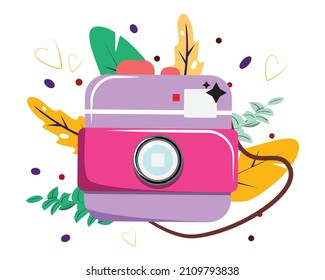 Camera isolated. Purple photo camera on leaves background. For print, cards, banners. 