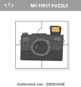Camera with a lens. Education paper game for preshool children. Vector illustration. Jigsaw puzzle. My first puzzle