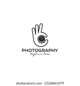 camera logo in the hands of the photographer