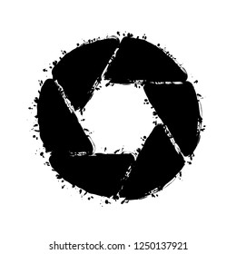 camera objective. simple silhouette. Black ink with splashes on white background