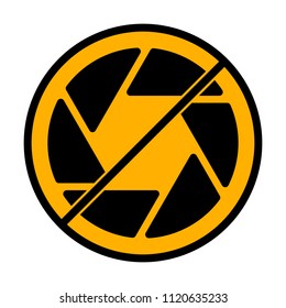 camera objective. simple silhouette. not allowed, black object in warning sign with orange background color