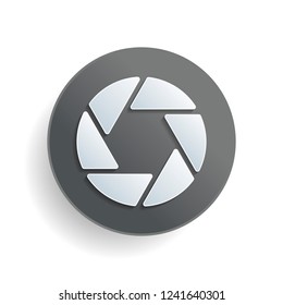 camera objective. simple silhouette. White paper symbol on gray round button with shadow