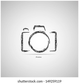 camera on a gray background is drawn with chalk