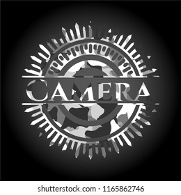 Camera on grey camouflage pattern