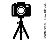 Camera on stand tripod icon in modern silhouette style design. Vector illustration isolated on white background.