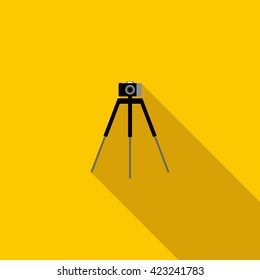 Camera on a tripod icon, flat style
