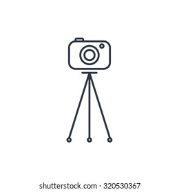 Camera on tripod outline icon 
