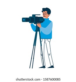 Camera operator in blue sweater holding video equipment and filming. Isolated cartoon cameraman working on film production - television crew member vector illustration