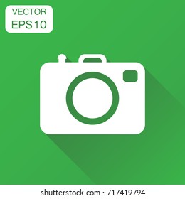 Camera photographer icon. Business concept photography camera pictogram. Vector illustration on green background with long shadow.
