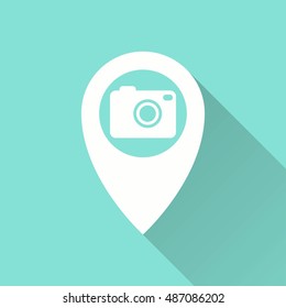 Camera pin vector icon with long shadow. White illustration isolated on green background for graphic and web design.