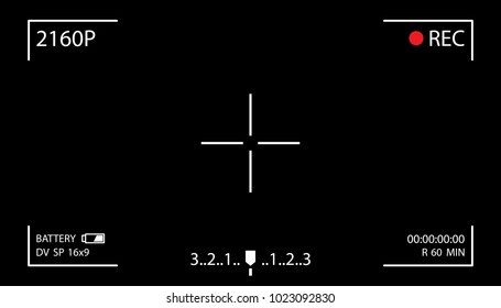 Camera screen with white frame, figures and battery symbol. Camcorder viewfinder on black background.