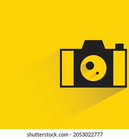 camera with shadow on yellow background