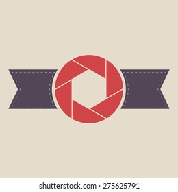 Camera shutter abstract icon with ribbon