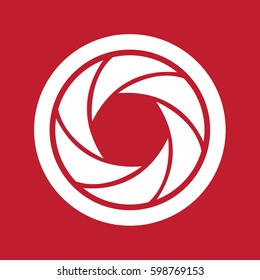 Camera shutter icon on red background