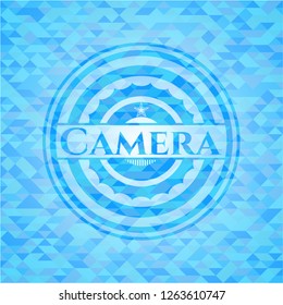 Camera sky blue emblem with triangle mosaic background