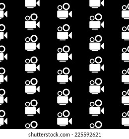 Camera symbol seamless pattern on black background. Vector illustration.