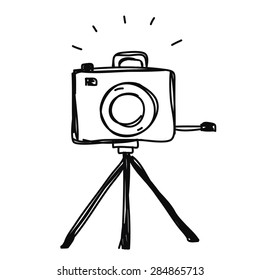 camera with tripod hand drawn vector