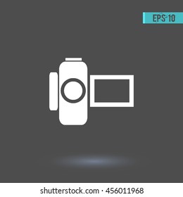 Camera vector icon. Graphic symbol for web design, logo. White glyph on a gray background. Isolated sign.