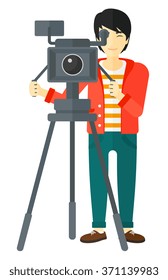 Cameraman with movie camera.