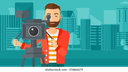 Cameraman with movie camera on a tripod.