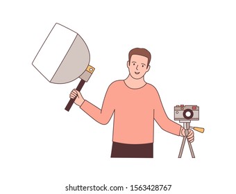 Cameraman with photographic equipment flat vector illustration. Professional photographer holding softbox and mirrorless camera. Photo studio worker cartoon character. Photo session design element.