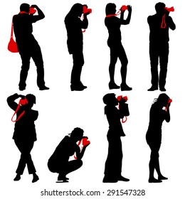 Cameraman with video camera. Silhouettes on white background. Vector illustration.