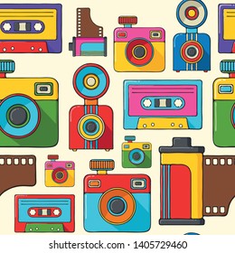 Cameras and audio cassettes hand drawn pop art style seamless pattern.